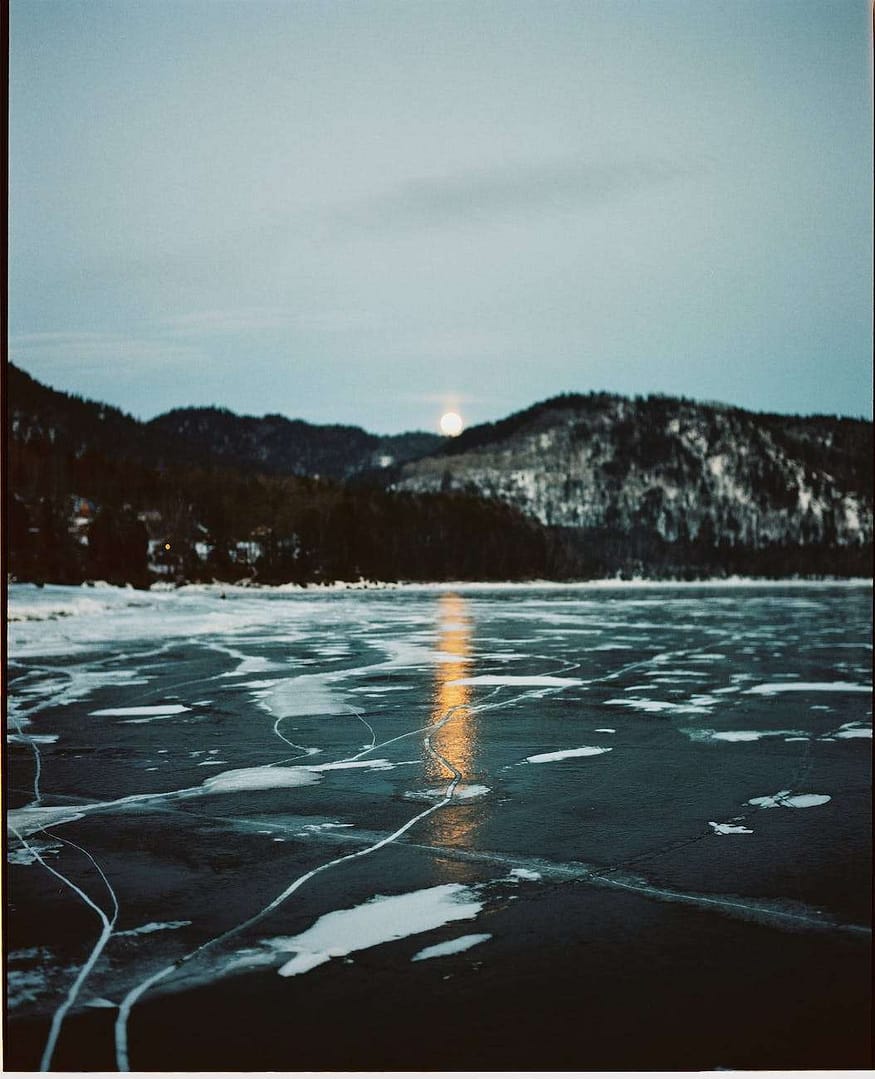 frozen lake at sunset in winter